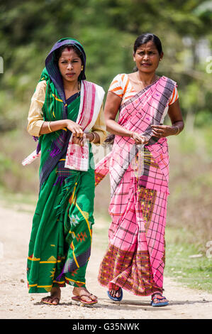 A family walks together in Pan Bari Village in the Kaziranga National Park in India on the 13th April 2016.  Credit: Euan Cherry Stock Photo