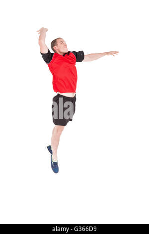 Sportsman hitting volleyball Stock Photo