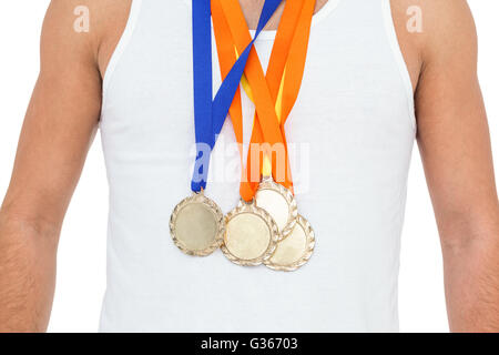 Athlete posing with gold medals around his neck Stock Photo