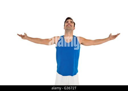 Excited male athlete with arms outstretched Stock Photo