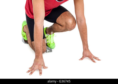 Male athlete in ready to run position Stock Photo