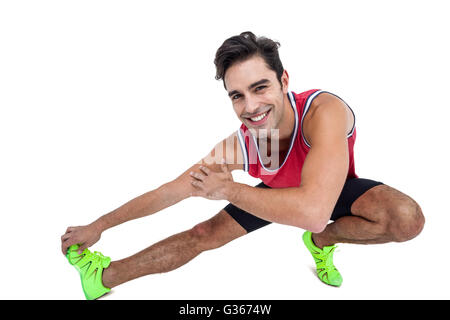 Portrait of male athlete stretching his hamstring Stock Photo