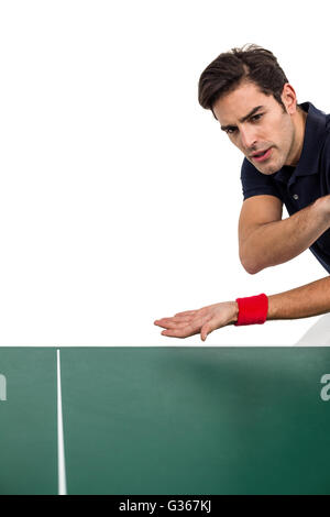 Confident male athlete playing table tennis Stock Photo