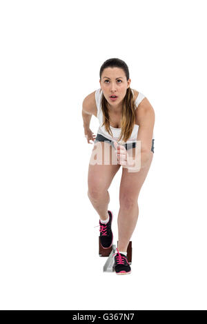 Athlete woman in ready to run position Stock Photo