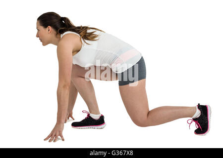 Athlete woman in ready to run position Stock Photo