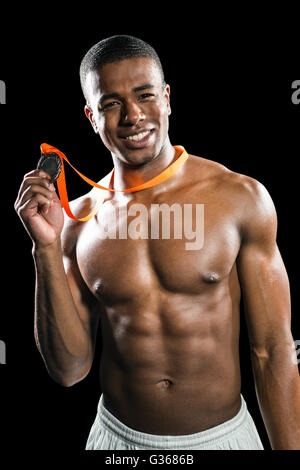 Fighter holding gold medal Stock Photo