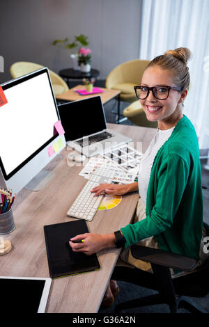 Casual businesswoman using a graphic tablet Stock Photo