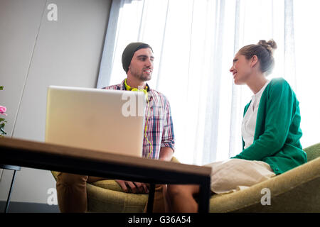 Coworkers talking and smiling Stock Photo