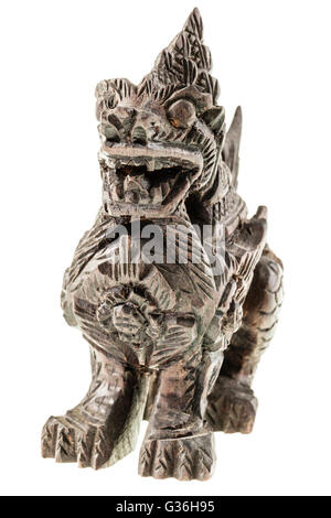 a wooden indonesian dragon statuette isolated over a white background Stock Photo