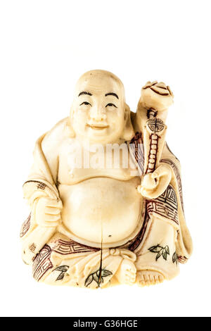 a smiling fat buddha statuette isolated over a white background Stock Photo