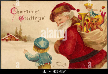 Father Christmas delivering Xmas presents Stock Photo