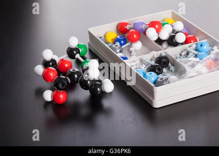 a plastic molecule structure modeling kit on a wooden surface Stock Photo