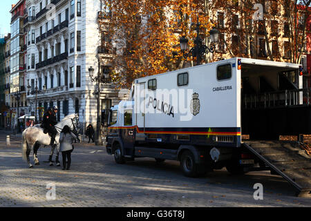 Police cavalry regiment truck and horses in Plaza del Oriente , Madrid , Spain Stock Photo