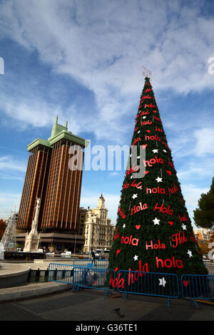 Christmas tree in Plaza de Colon, Torres de Colon building behind, Madrid, Spain Stock Photo