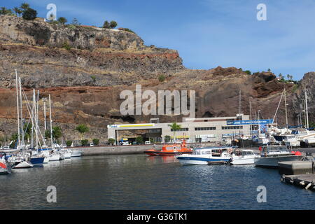 San Sebastian de la Gomera, capital of La Gomera with its harbour and a natural face in the volcanic rock above the port Stock Photo