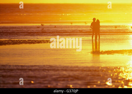 Couple on Cannon Beach Oregon Stock Photo