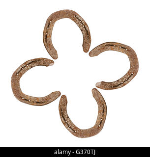 Horseshoes forming a clover leaf as a symbol for good luck Stock Photo