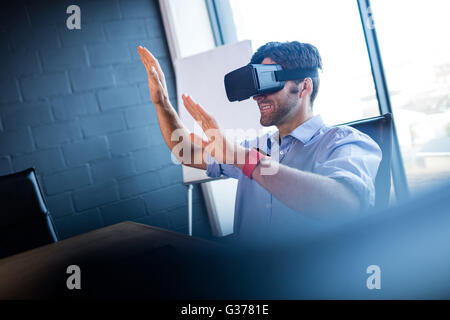 Businessman using virtual reality device Stock Photo
