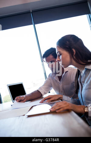 Colleagues reading documents Stock Photo