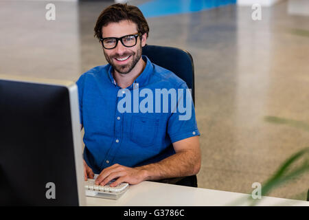 Casual businessman working on computer Stock Photo