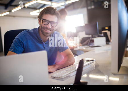 Casual businessman using computer Stock Photo