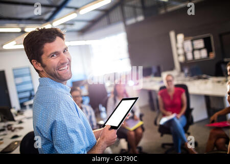 Casual businessman using a tablet Stock Photo
