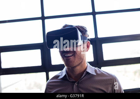 Businessman using virtual reality device Stock Photo