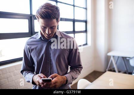 Businessman using smartphone Stock Photo