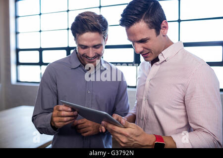 Businessmen using a tablet Stock Photo