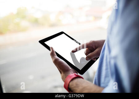 Hand using tablet computer Stock Photo