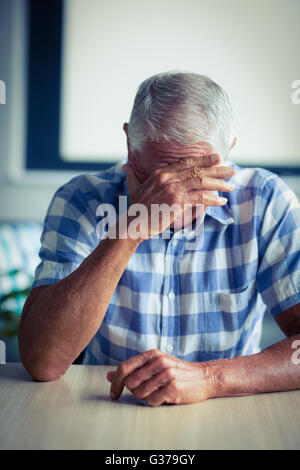 Senior man suffering from headache Stock Photo