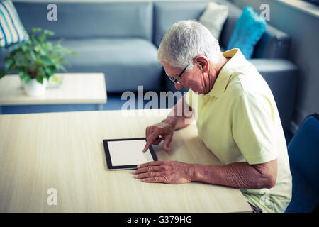 Senior man using digital tablet Stock Photo