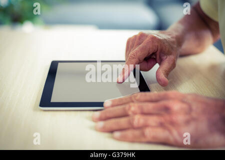 Senior man using digital tablet Stock Photo