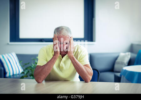 Senior man suffering from headache Stock Photo