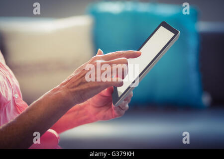 Senior woman using digital tablet Stock Photo