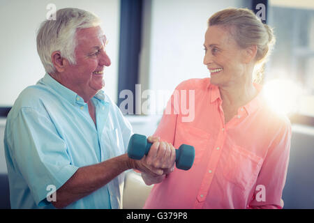Senior couple exercising at home Stock Photo