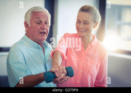 Senior couple exercising at home Stock Photo