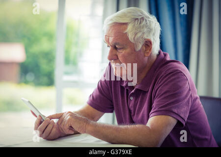 Senior man using mobile phone Stock Photo