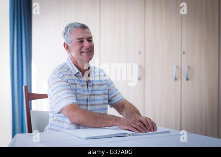 Blind man reading a braille book Stock Photo