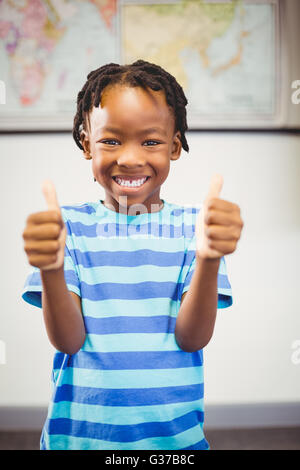 Portrait of a smiling schoolboy with the thumbs up Stock Photo - Alamy
