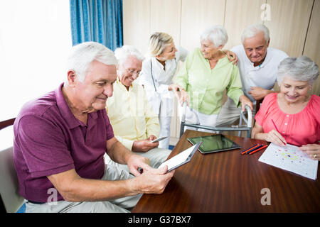 Seniors using technology Stock Photo