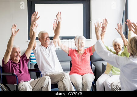 Seniors doing some exercises Stock Photo