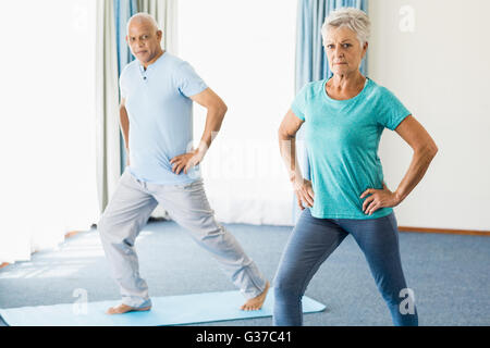 Seniors doing sport exercises Stock Photo