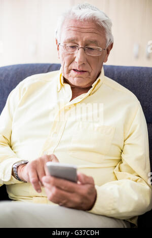 Senior using a smartphone Stock Photo