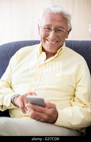 Senior using a smartphone Stock Photo