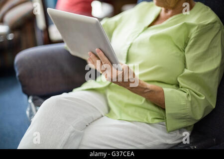 Senior woman using a tablet Stock Photo