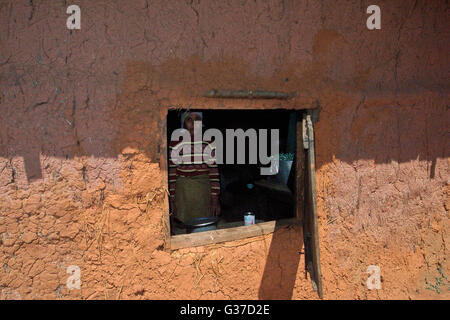 Asia, Kengtung, Loimwe, Shan State, Myanmar, Burma home in the ground with small window Stock Photo