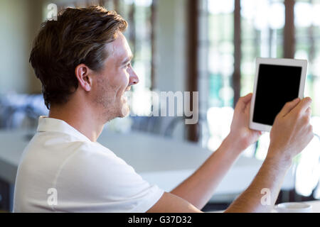 Happy man using digital tablet Stock Photo