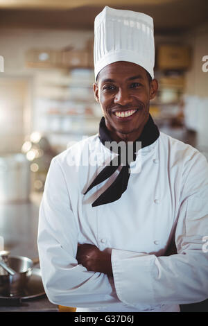 Portrait of smiling chef standing with arms crossed Stock Photo