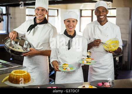 Portrait of chefs preparing a dessert Stock Photo